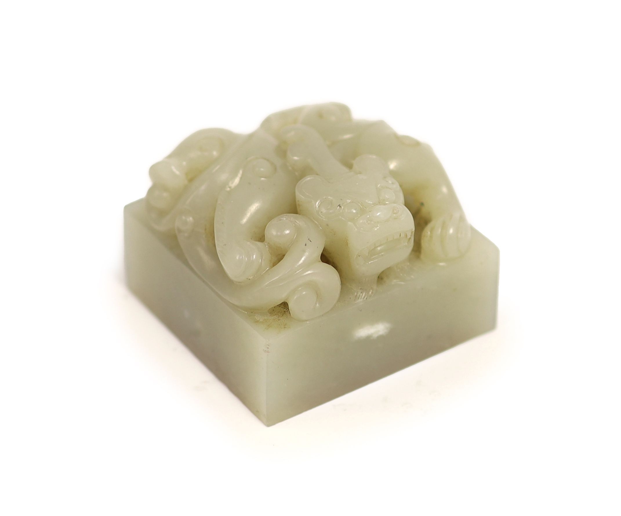A Chinese pale grey jade ‘chilong’ seal, 5cm square